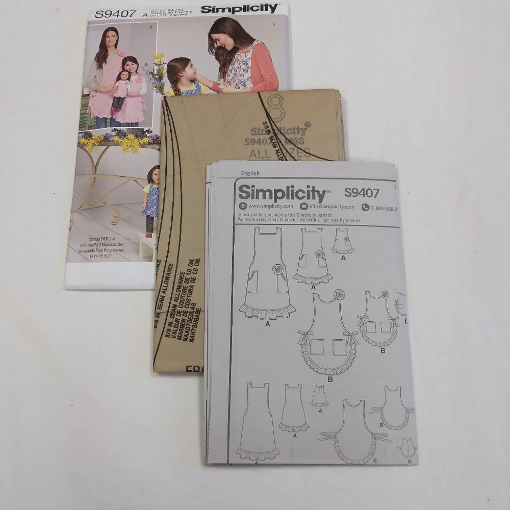 Simplicity S9407 Cute Aprons in adult child & American Girl Doll sizes.
